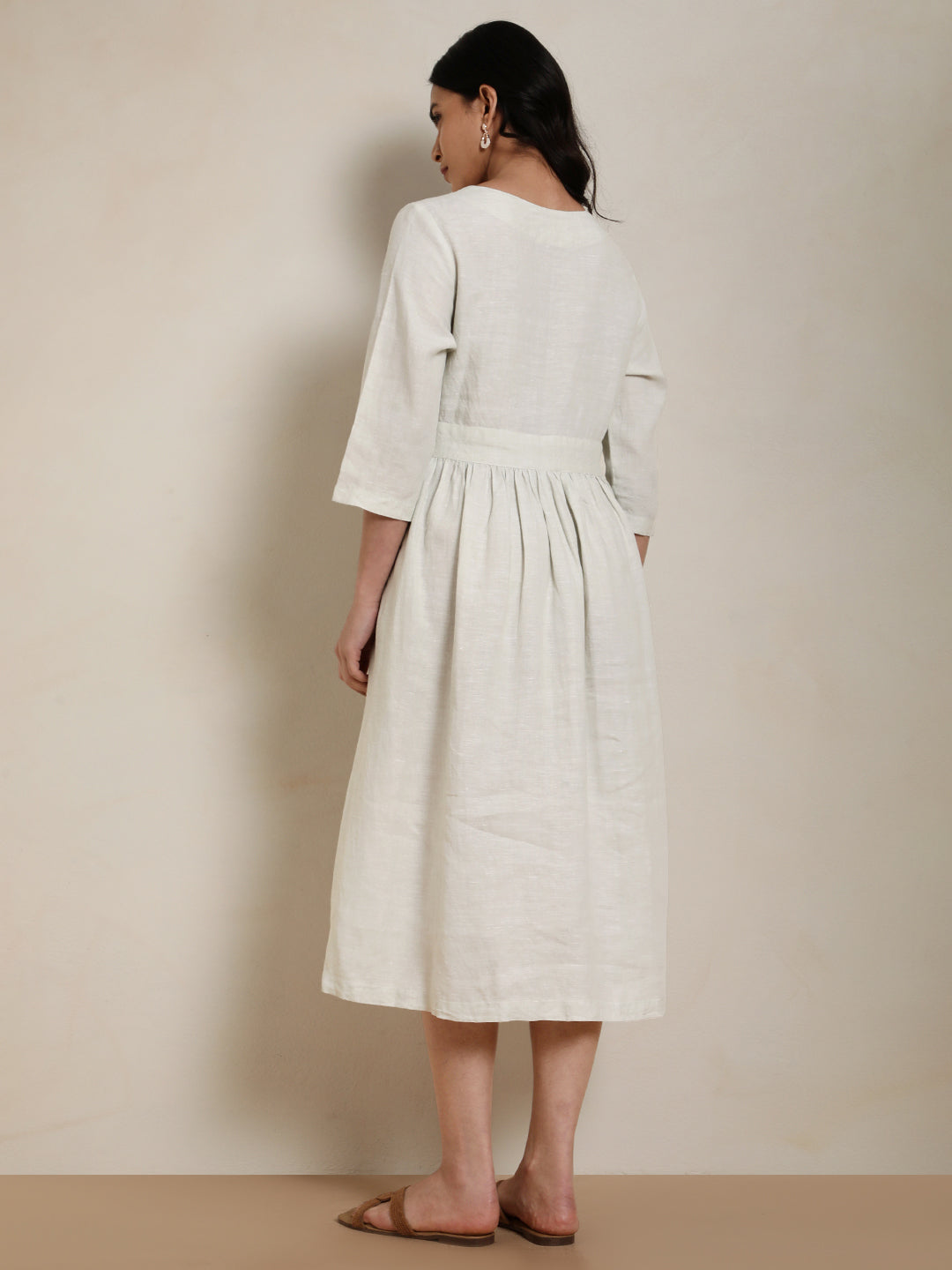 “EcoThread sustainable women’s wear – linen wrap dress back view”